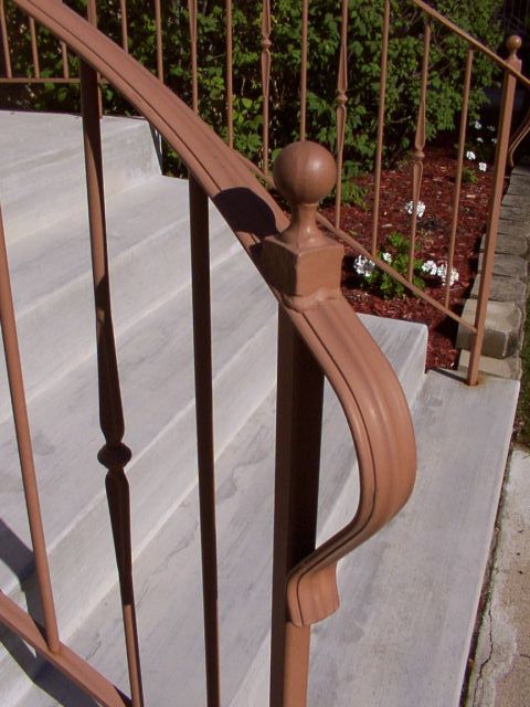 "Ronde" style railing with optional flaired front and cast ball finials
