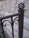 "Verona" style. 2 in. newel posts with ball basket finial. Color: Bronzetone