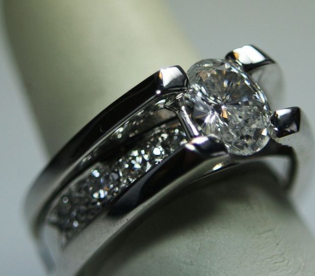 14K White Gold Custom made wedding Set w/ 1.41ct oval center & .80ct total round side diamonds.