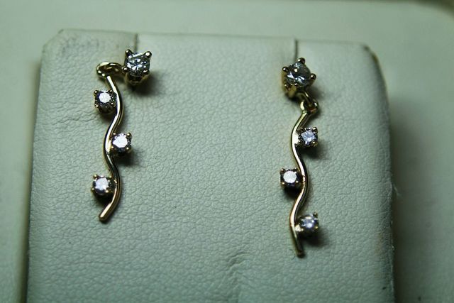 Ladies Yellow Gold Wave Design Earrings - .50ct total round diamonds