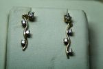 Ladies Yellow Gold Wave Design Earrings - .50ct total round diamonds